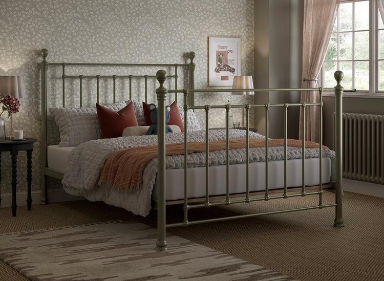 Vintage bedroom ideas - Antique-style brass metal bed frame, with traditional finials and castings, styled in a classic bedroom.