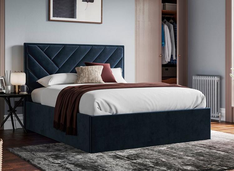 Velvet bedroom ideas - Navy blue ottoman bed with chevron design, styled in a light blue bedroom
