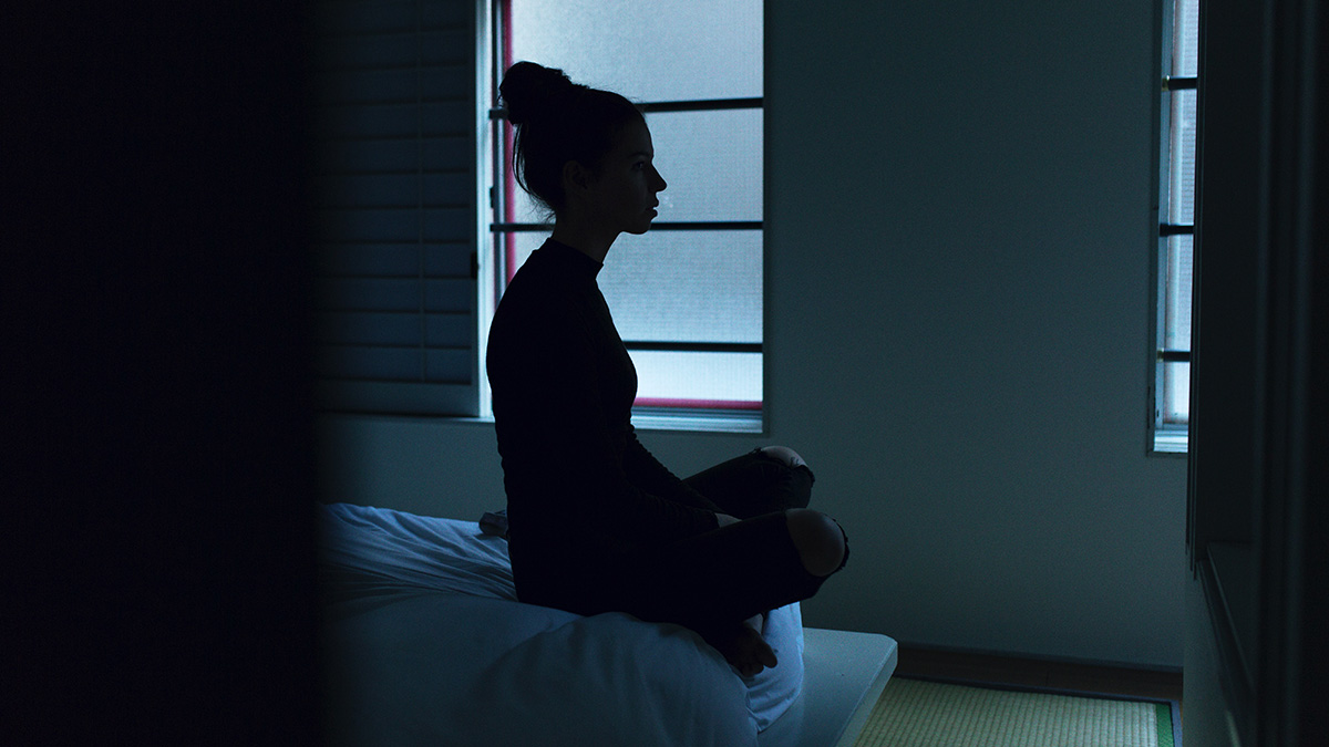 woman awake at nighttime to show insomnia