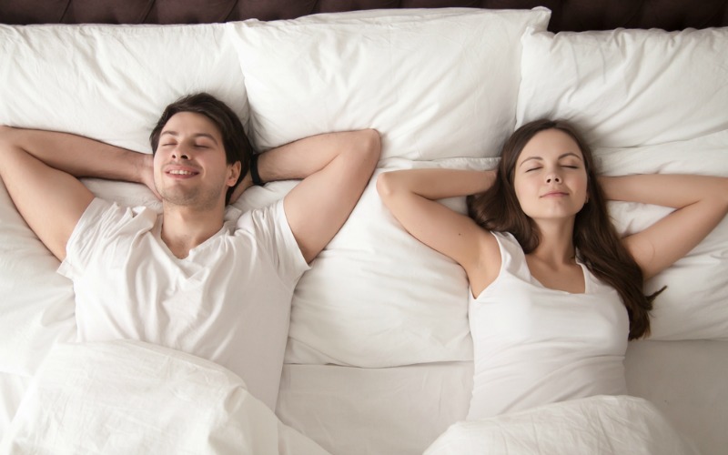 Couple happy in bed.