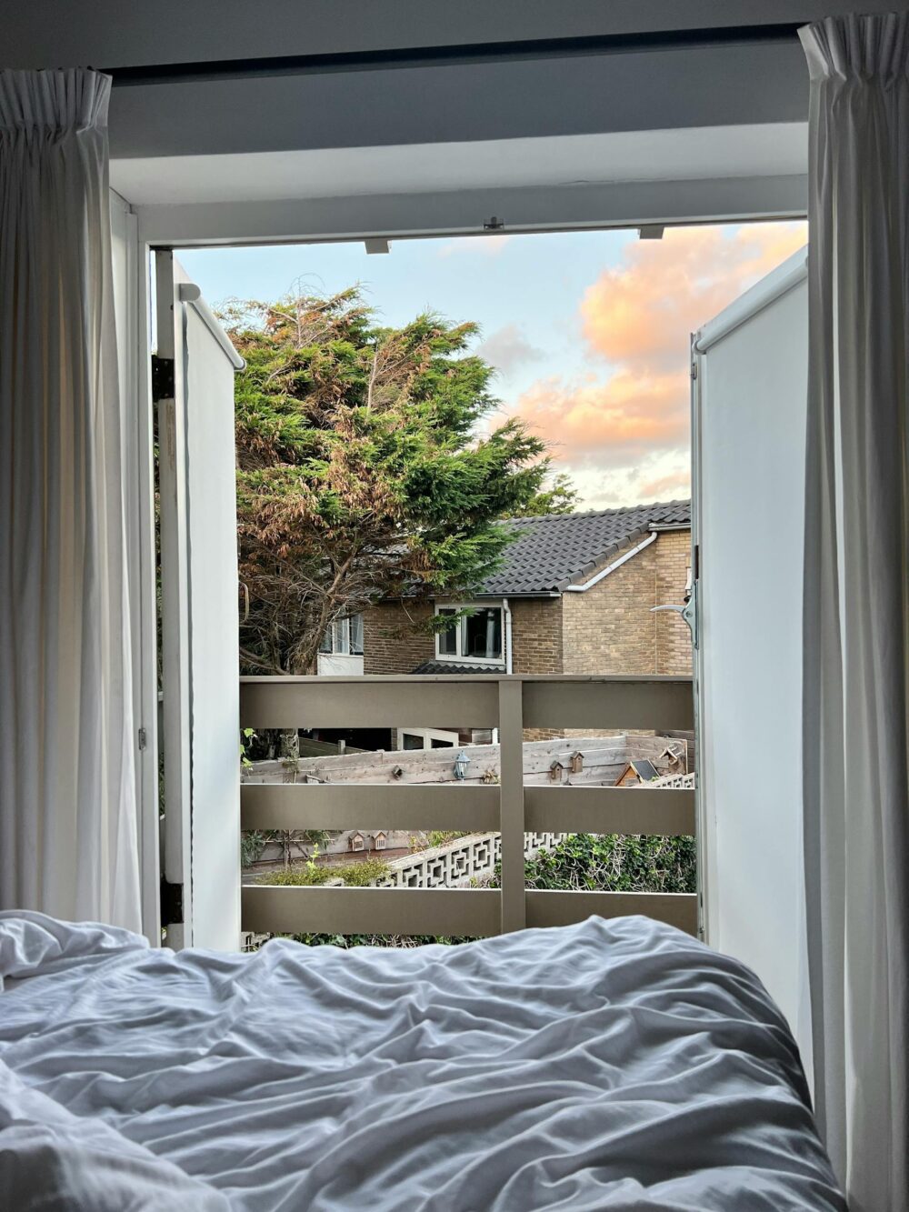 9. Open windows to create a breeze - How to Keep Cool at Night