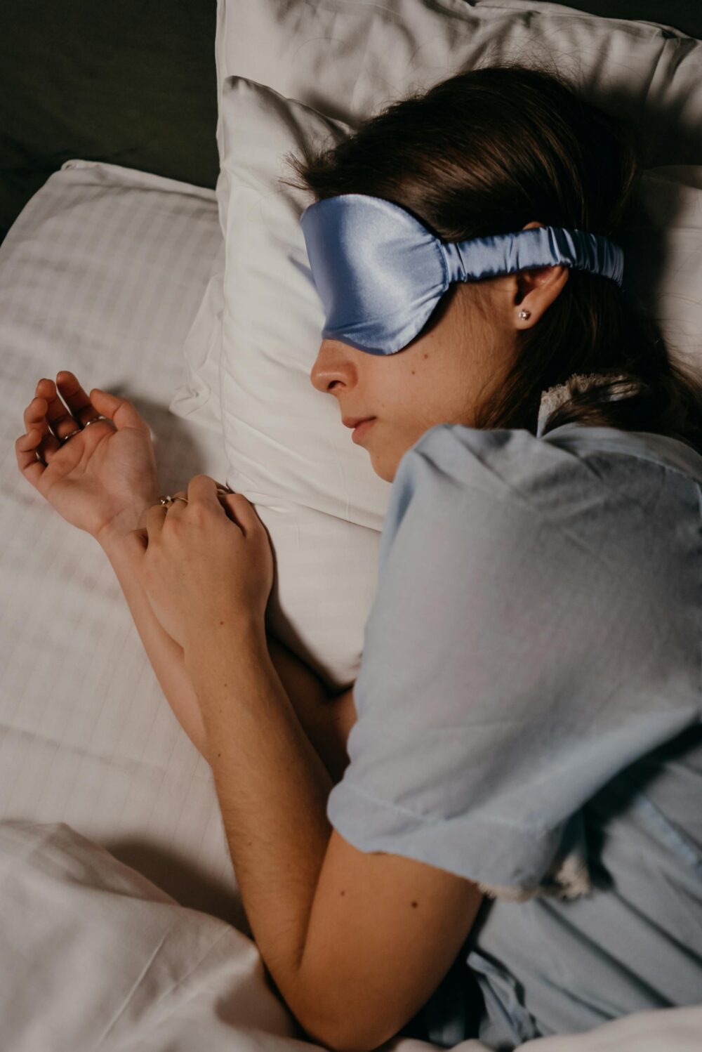 Lady sleeping with eye mask.